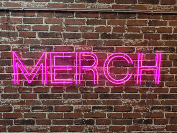 Live example of a custom MERCH neon sign for a party