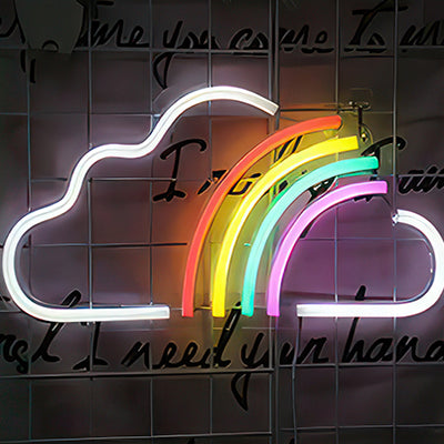 Neon cloud with rainbow in white, red, yellow, blue and purple LED lights in child's bedroom