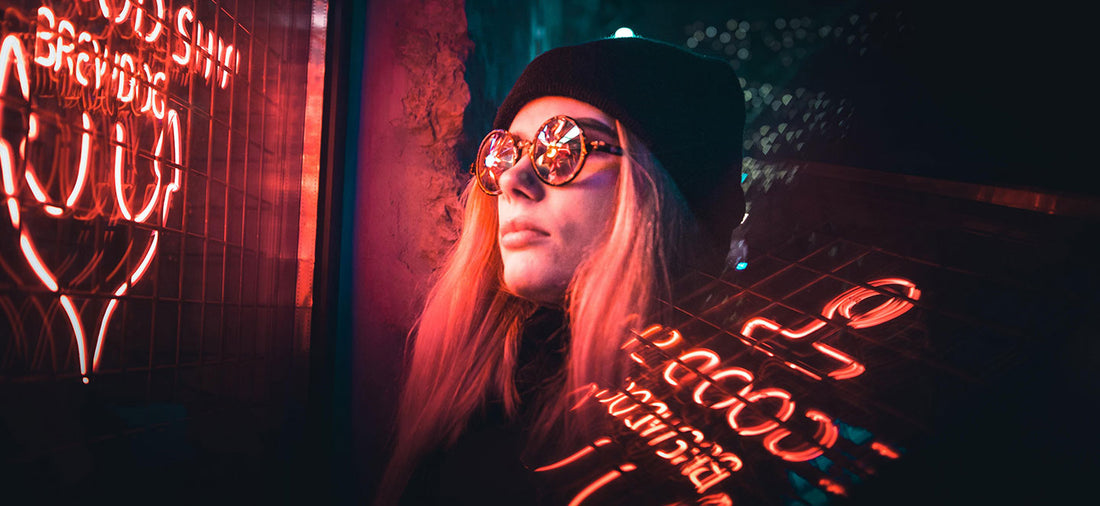 Woman looking at a bar neon sign