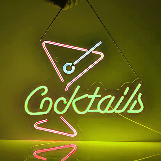 Cocktails logo neon sign in red, yellow, and pink LED