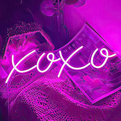 XOXO neon sign letters in pink LED