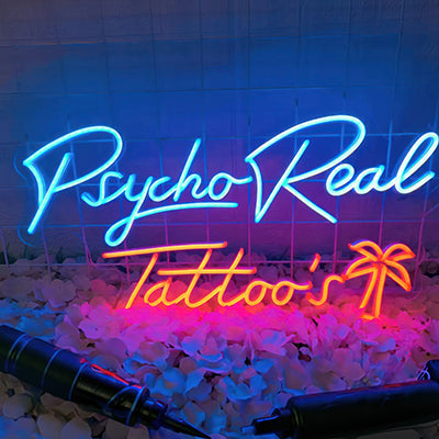 Psycho Real Tattoo's neon logo sign