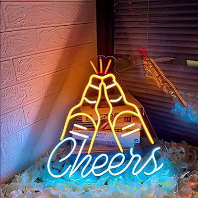 2 beer bottles clinking together with the word cheers underneath LED light