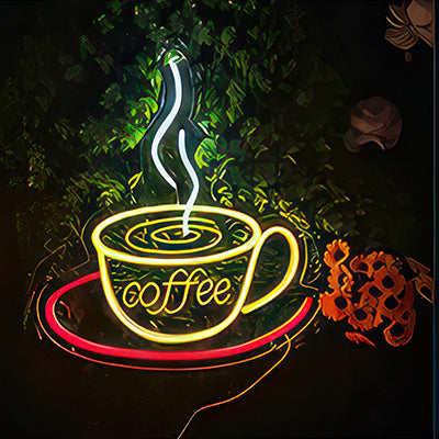 A coffee cup neon sign with steam rising off the coffee in white, yellow and red LED lights