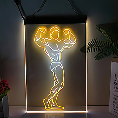 Picture of bodybuilder flexing muscles in LED neon lights yellow, orange and white