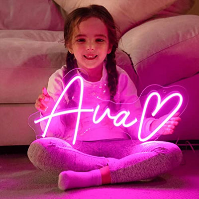 Ava neon name sign with a love heart - little girl holding the pink light sign