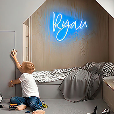 Kids neon name sign for Ryan in blue LED lights in bedroom