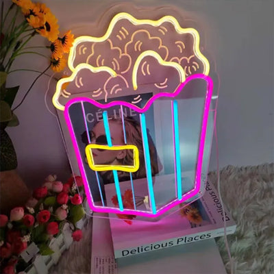Bucket of popcorn neon light sign in yellow, purple, blue and yellow