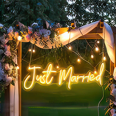 Just married neon sign for wedding decor in yellow LED lights in marquee at wedding venue