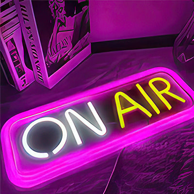 On Air neon sign podcast sign for Youtube in pink, white and yellow lights