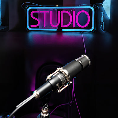 LED sign of the word STUDIO for ideas of a YouTube and podcast background shot
