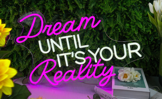 FAQ - neon sign "Dream until its your reality"