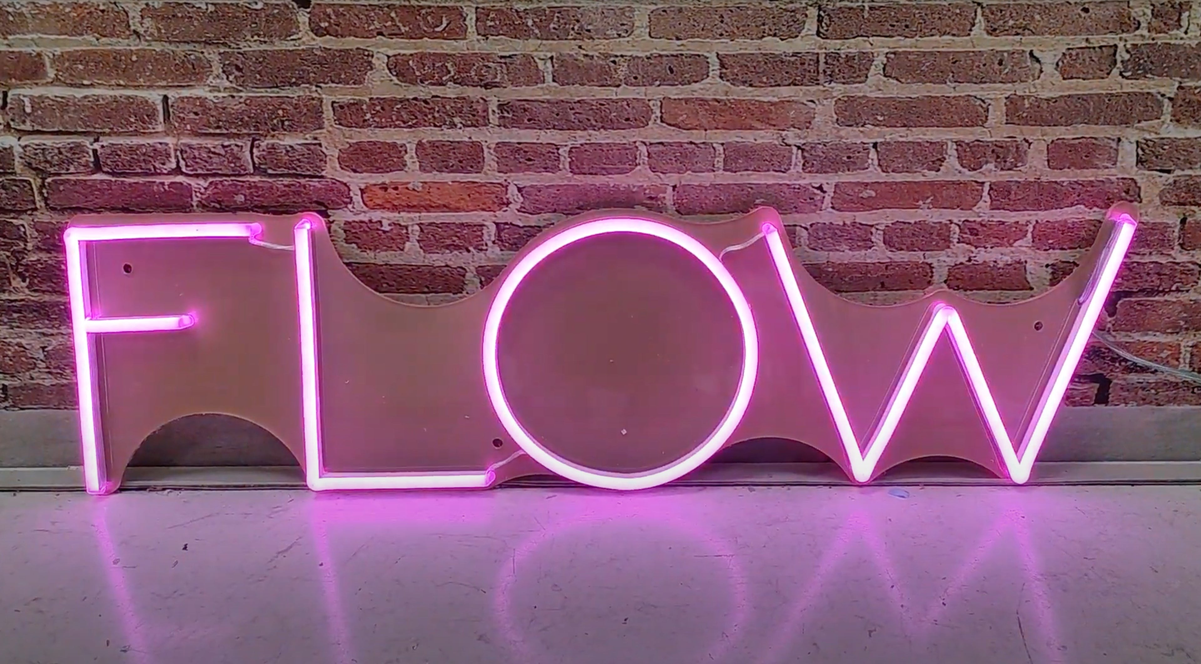 Load video: Flow pink neon sign