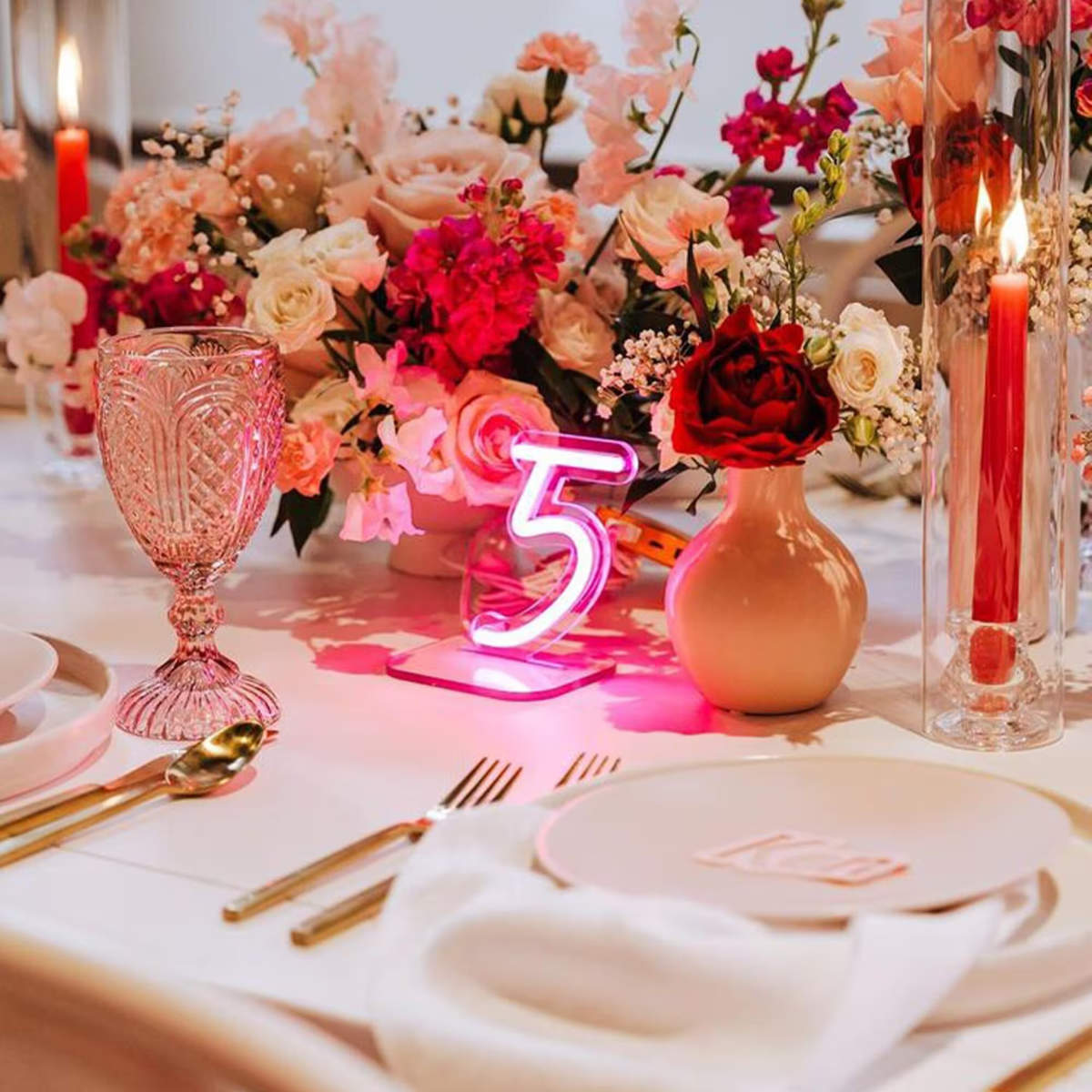 Neon table numbers with a pink neon sign number 5